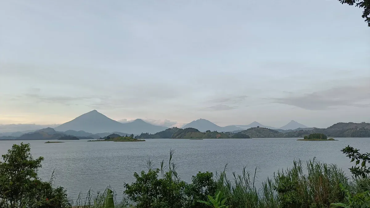 The Virunga volcanoes seen across Lake Muntanda in Kisoro District